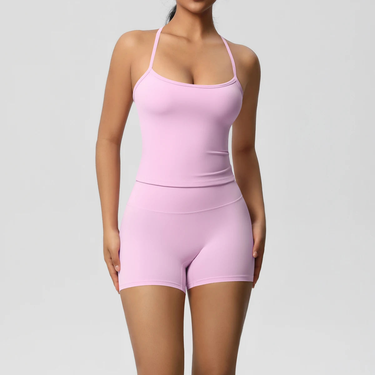 Rosa/pinkfarbenes nahtloses Yoga-Set mit Trägertop und kurzen Leggings-Shorts