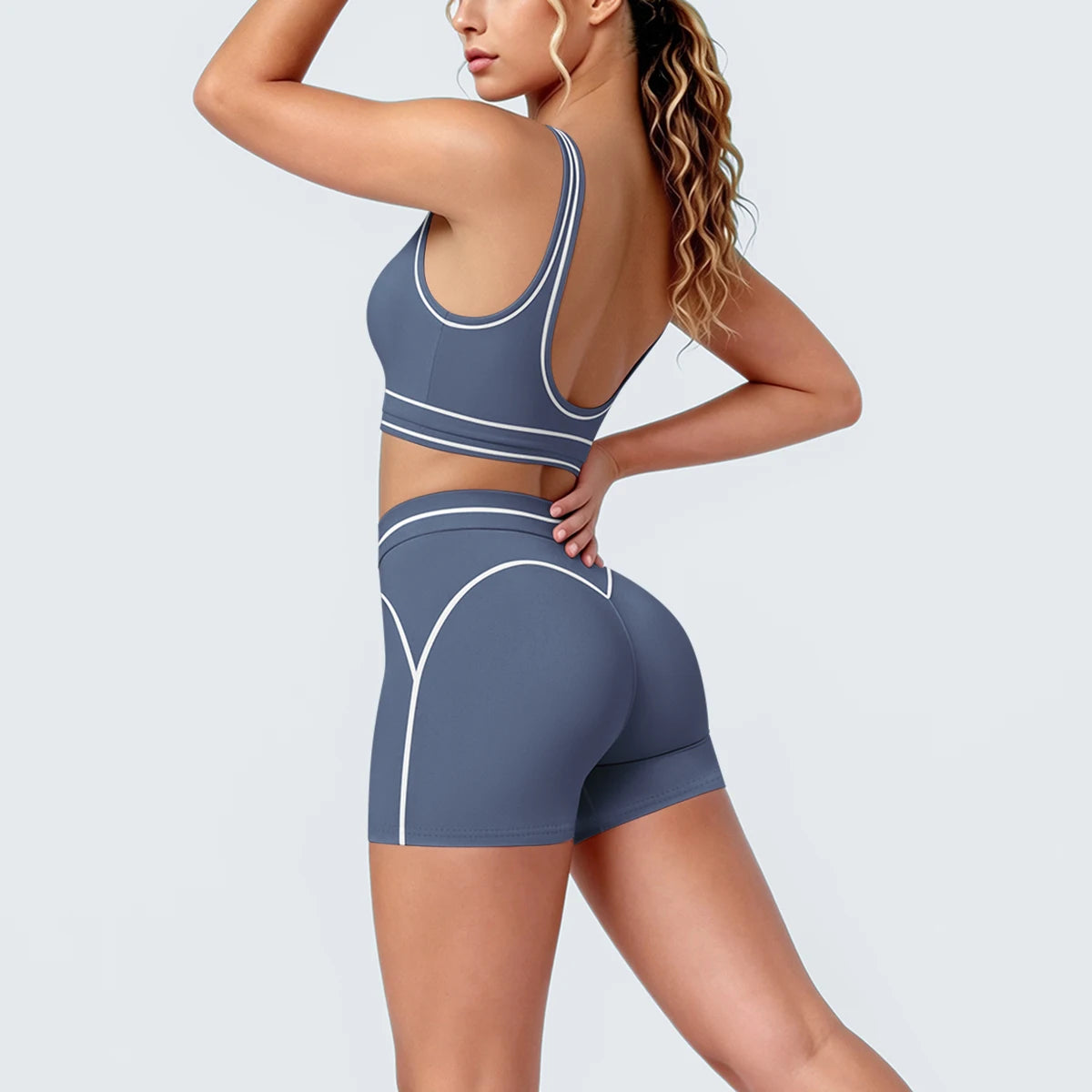 Yoga-Set mit Sport-BH und Shorts, dunkelblau, Detailansicht mit weißen Zierlinien