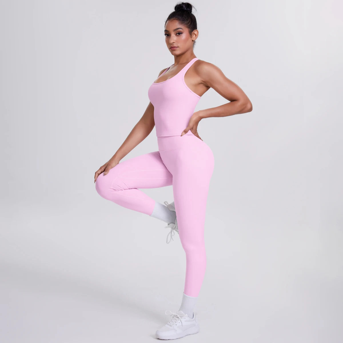Damen Yoga-Set mit Trägertop und Leggings, einfarbig rosa, seitlich in Dehnung