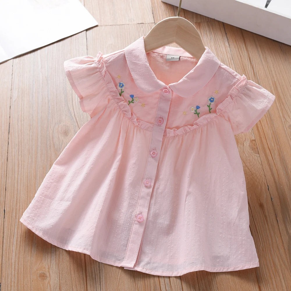 Kinderbluse aus Baumwolle, rosa, bestickt mit Blumen, Knopfleiste und Rüschenärmeln