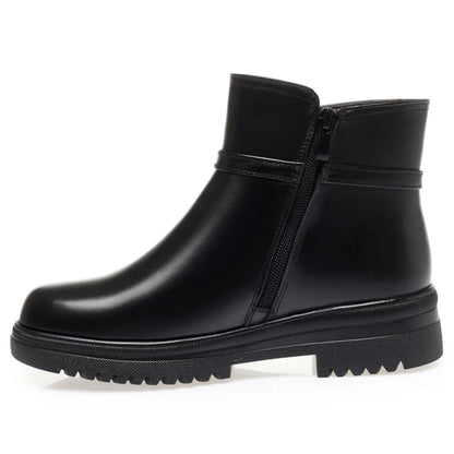 Schwarzer Winterstiefel mit seitlichem Reißverschluss und profilierter Gummilaufsohle