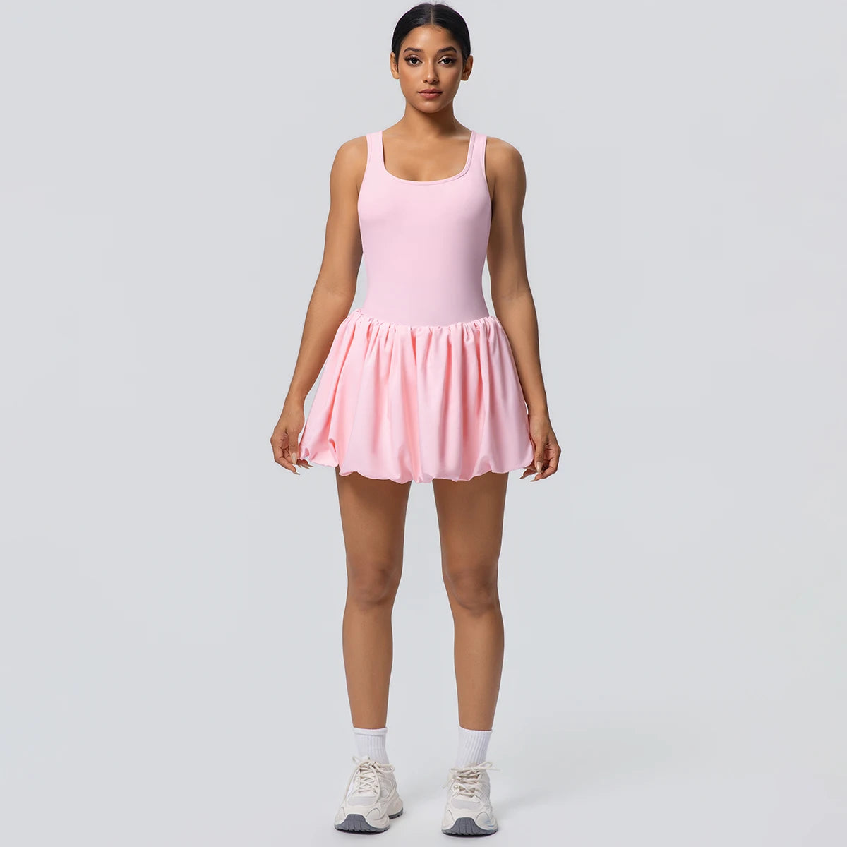 Damen-Tennisrock mit Taschen, rosa Faltenrock, kurzer Saum und elastischer Bund.