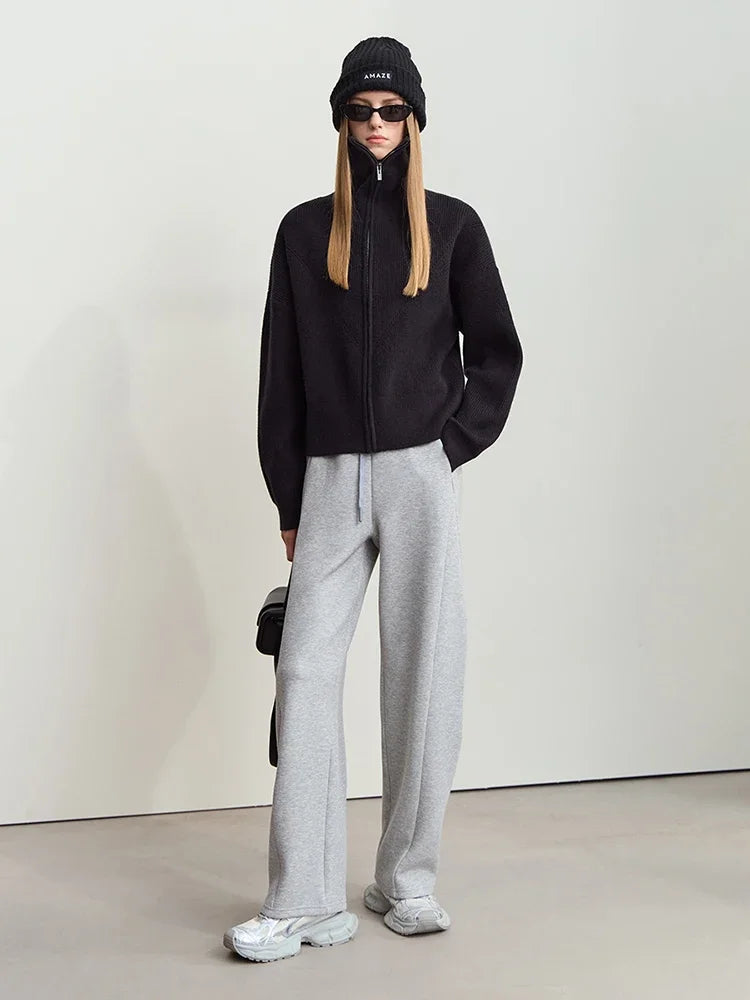 Schwarze Wollstrickjacke mit Reißverschluss und geripptem Stehkragen