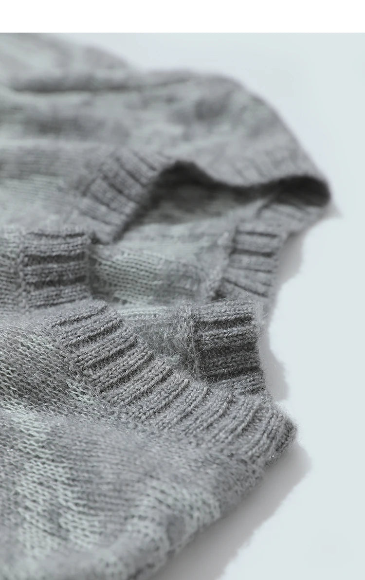 Damenpullover-Stoffdetail: grauer Strick mit geripptem Bund und feinem Jacquard