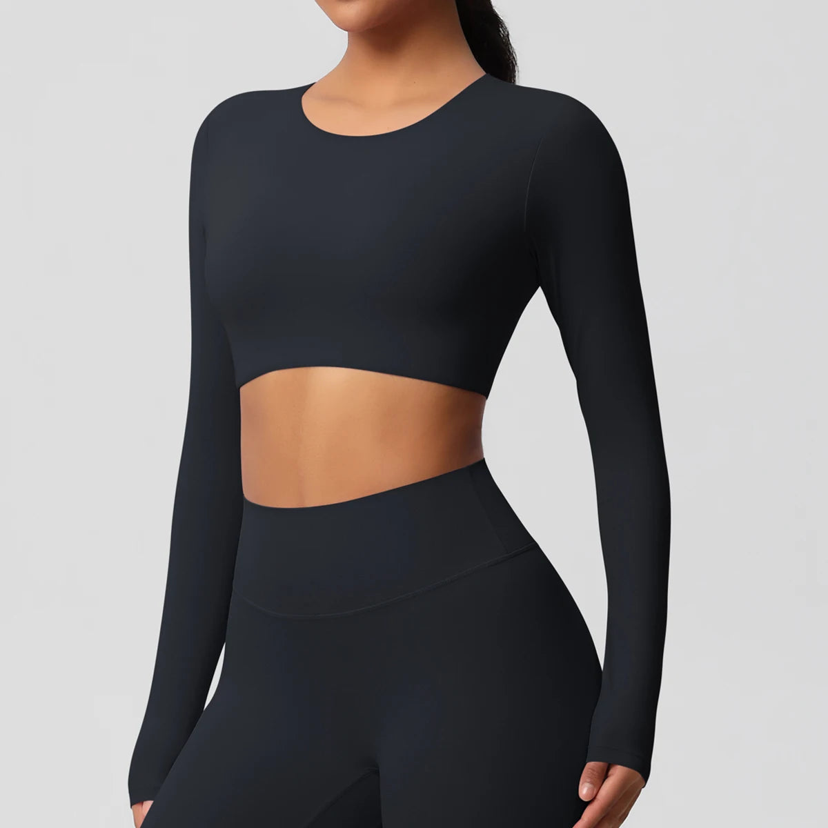 Damen Sportshirt mit Rundhalsausschnitt, langarm, kurz geschnitten, schwarz