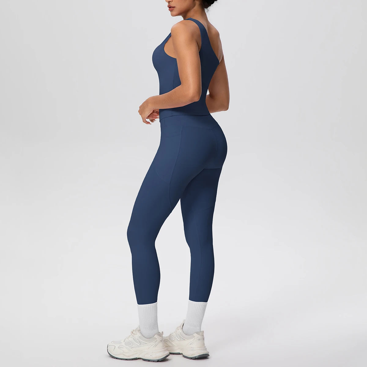 Yoga-Set aus ärmellosem Top und Leggings, dunkelblau; Rückansicht mit hellem Beinabschluss