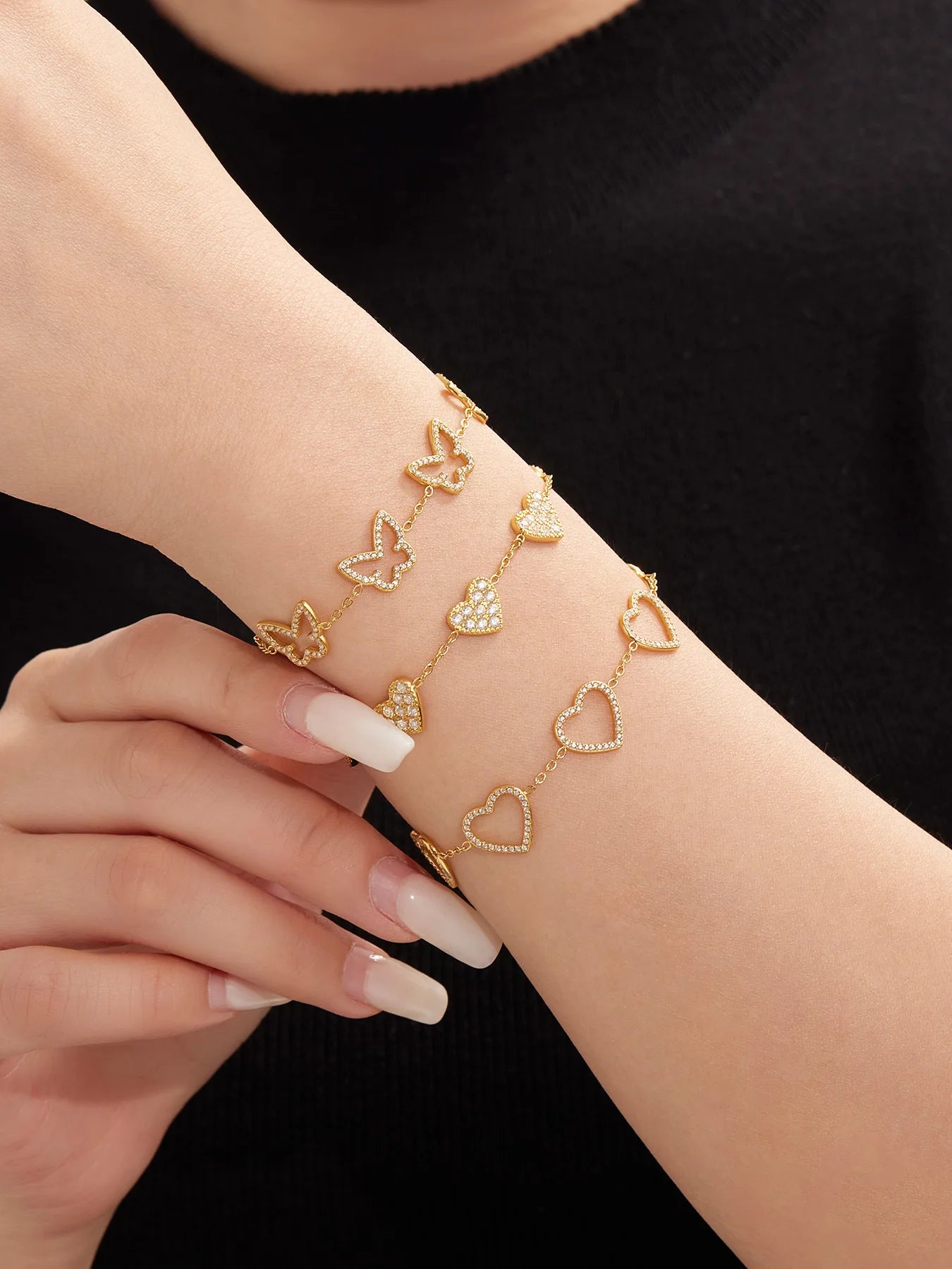 Damen-Charm-Armband mit Herzschleife und Zirkonia