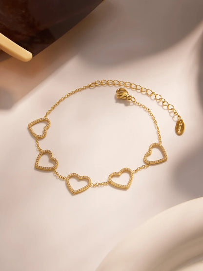 Damen-Charm-Armband mit Herzschleife und Zirkonia