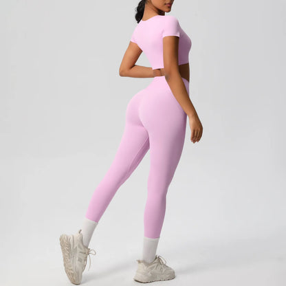 Yoga-Set für Damen: Crop-Top und High-Waist-Leggings, hellrosa, seitliche Ansicht.