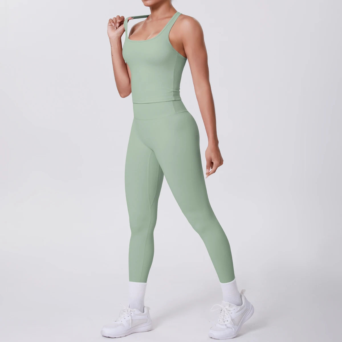 Damen-Yoga-Set: hellgrünes Tanktop und Leggings, körperbetont, knapp über dem Knöchel