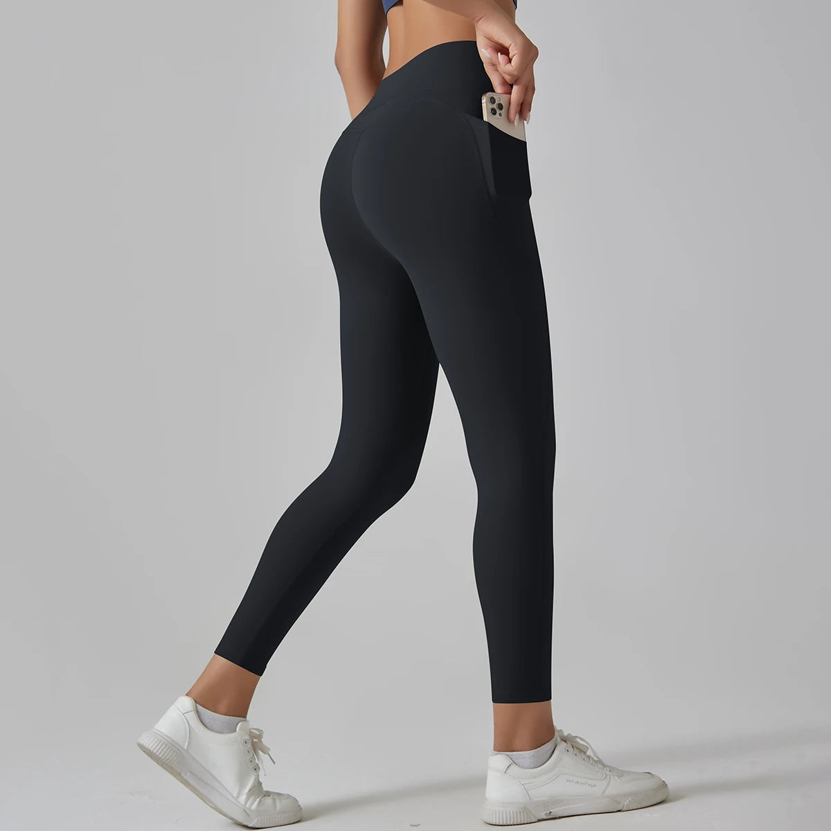 Schwarze High-Waist-Leggings mit Taschen, seitliche Ganzansicht
