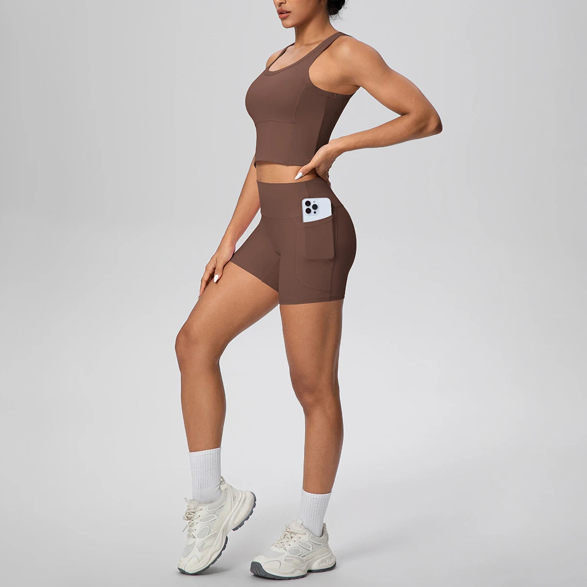Damen Fitness-Set aus Weste und Laufshorts, dunkelblau, Vorderansicht mit Taschenfach