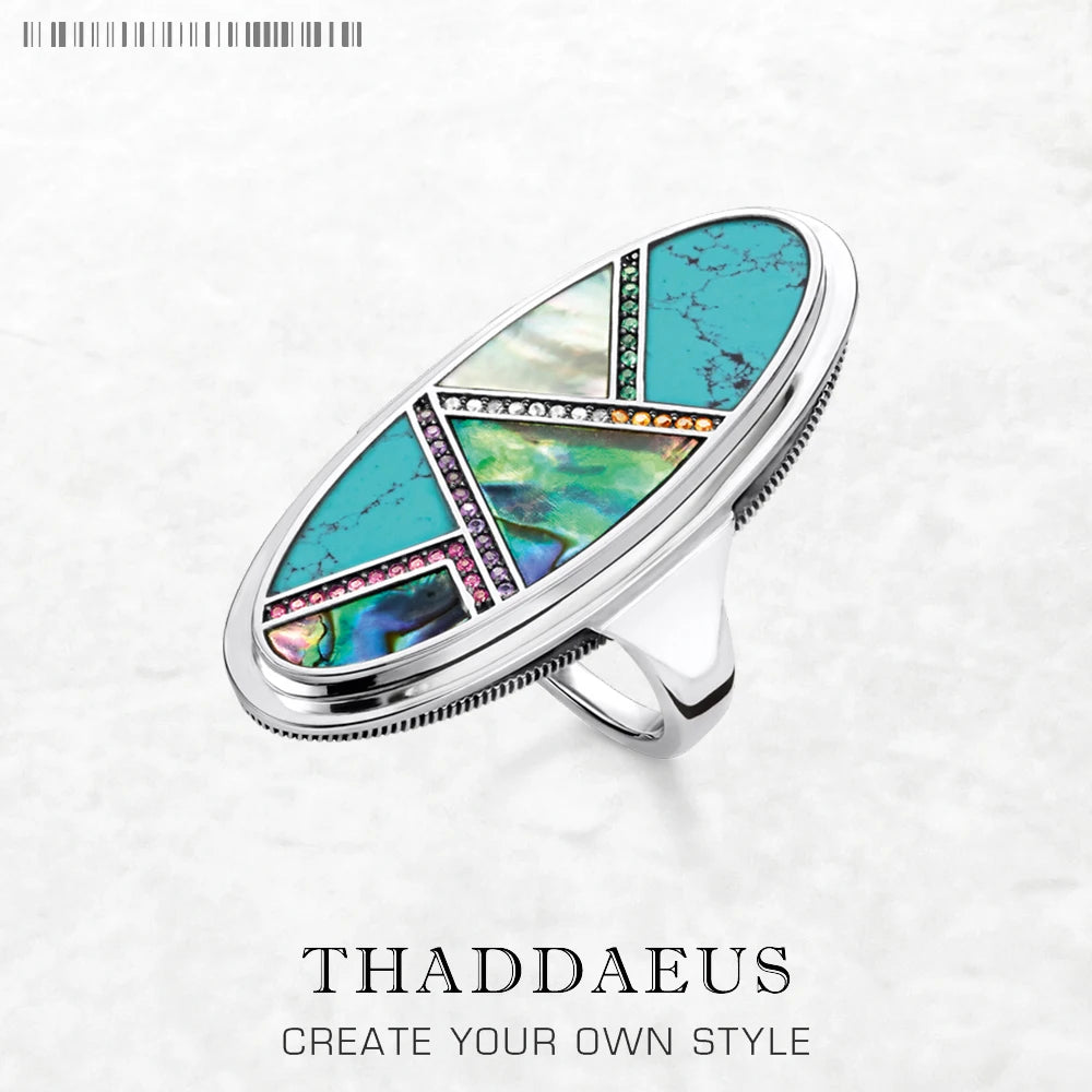 Silberner Ring aus 925 Sterling mit ovalem Türkis-Einsatz und Schmuckdetails am Band