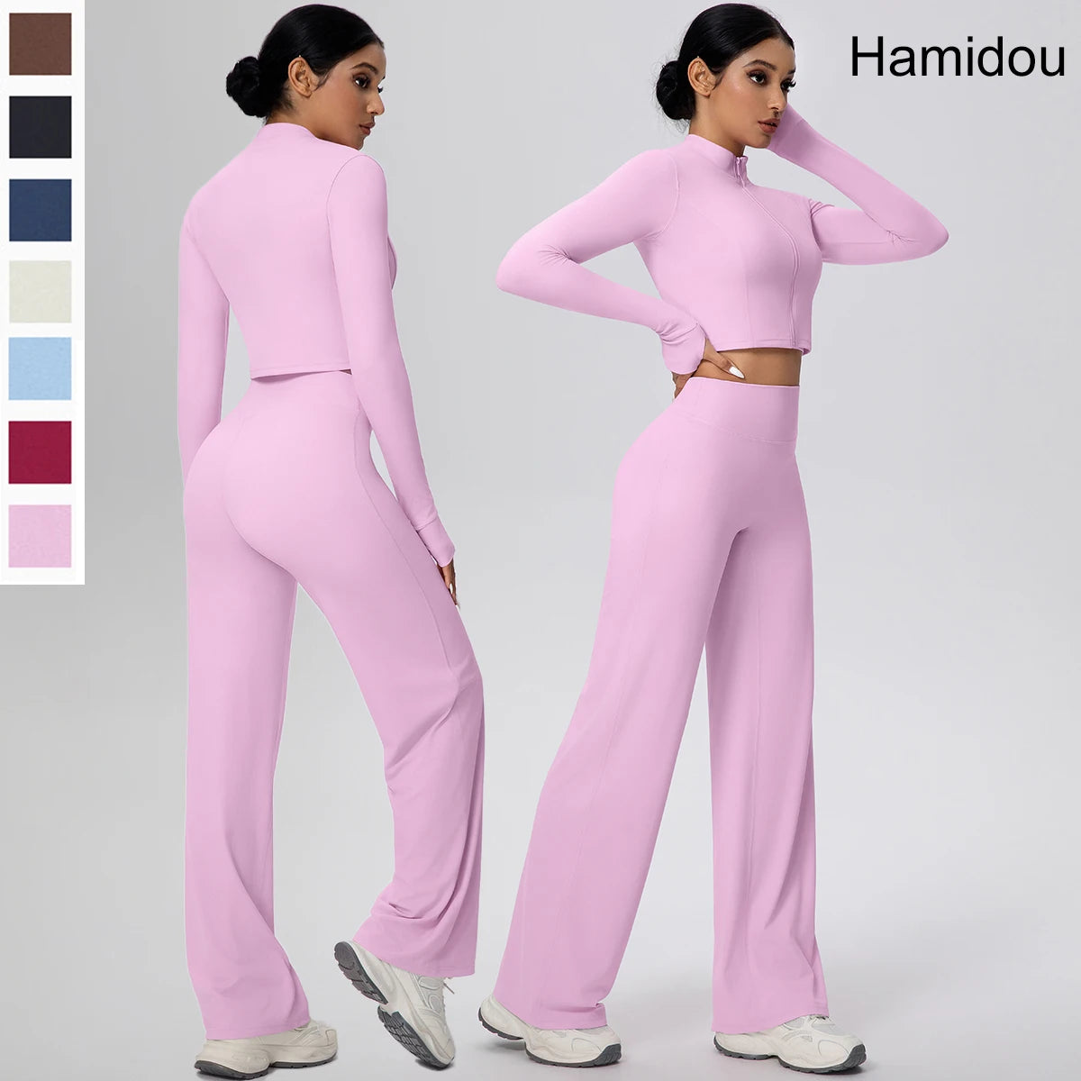 Rosa Yoga-Set mit Reißverschluss-Crop-Top und High-Waist-Hose, weite Beine.