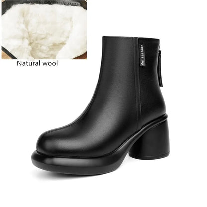 Schwarze Leder-Stiefelette mit Blockabsatz und Wollfutter am oberen Schaftrand