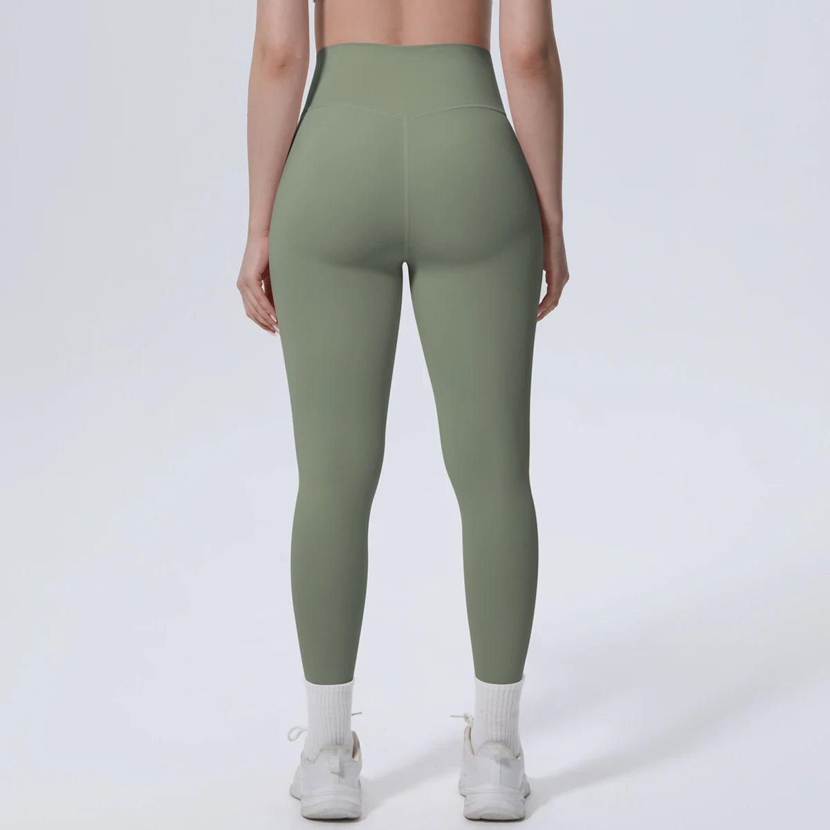 High-Waist-Yogaleggings olivgrün, Vorderansicht, schmales 3/4-Bein mit Bund