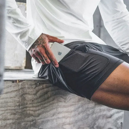 Locker geschnittene Herren-Sportshorts mit schneller Trocknung und Splicing-Design – ideal für Fitness und Basketball