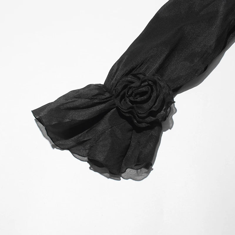 Zweiteiliges Damen-Set mit schulterfreiem Oberteil, langen Ärmeln und Schleifendetail sowie Patchwork-Rock mit Rüschen – elegant und modern.
