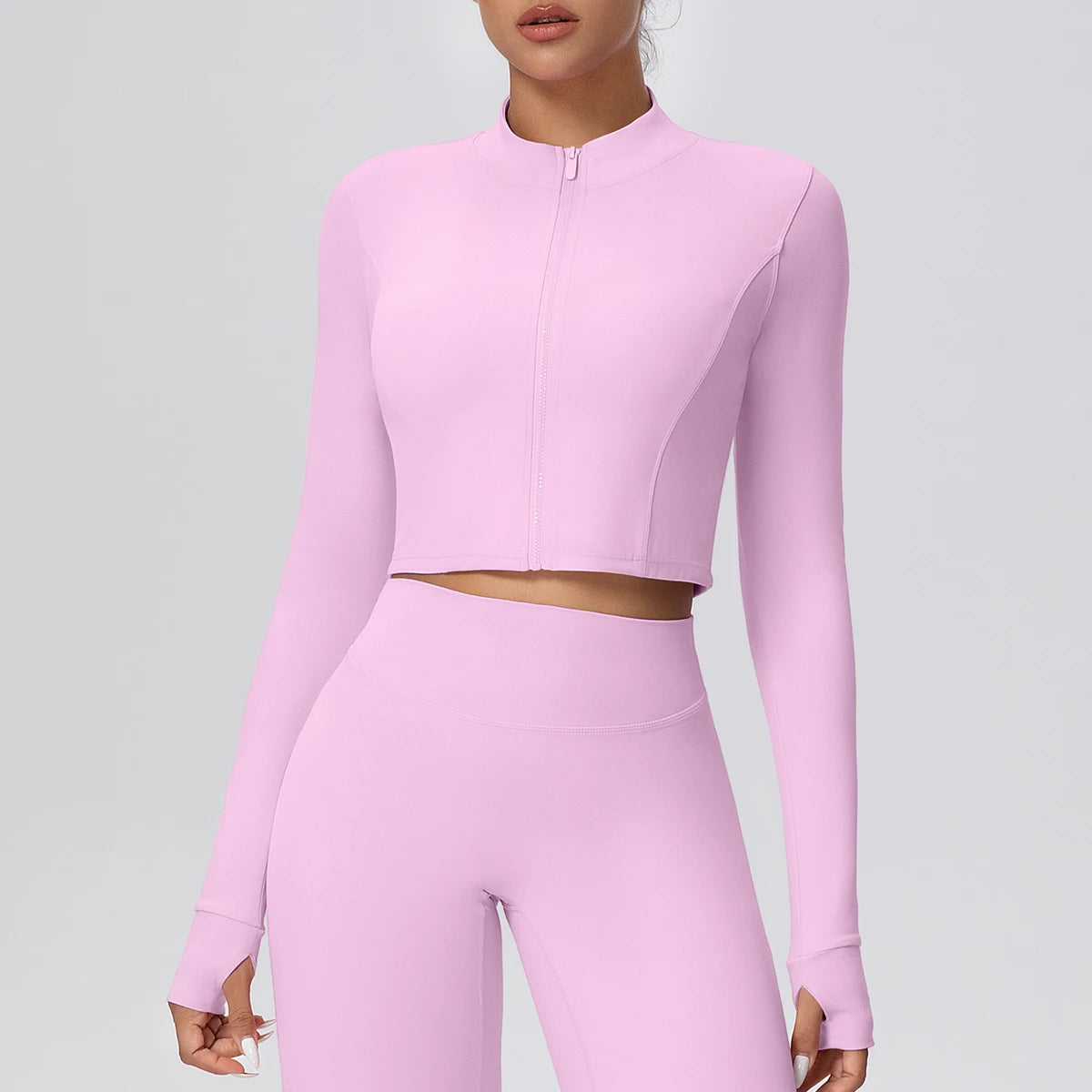 Damen Sportjacke mit kurzem Schnitt, durchgehendem Reißverschluss, langen Ärmeln, rosa