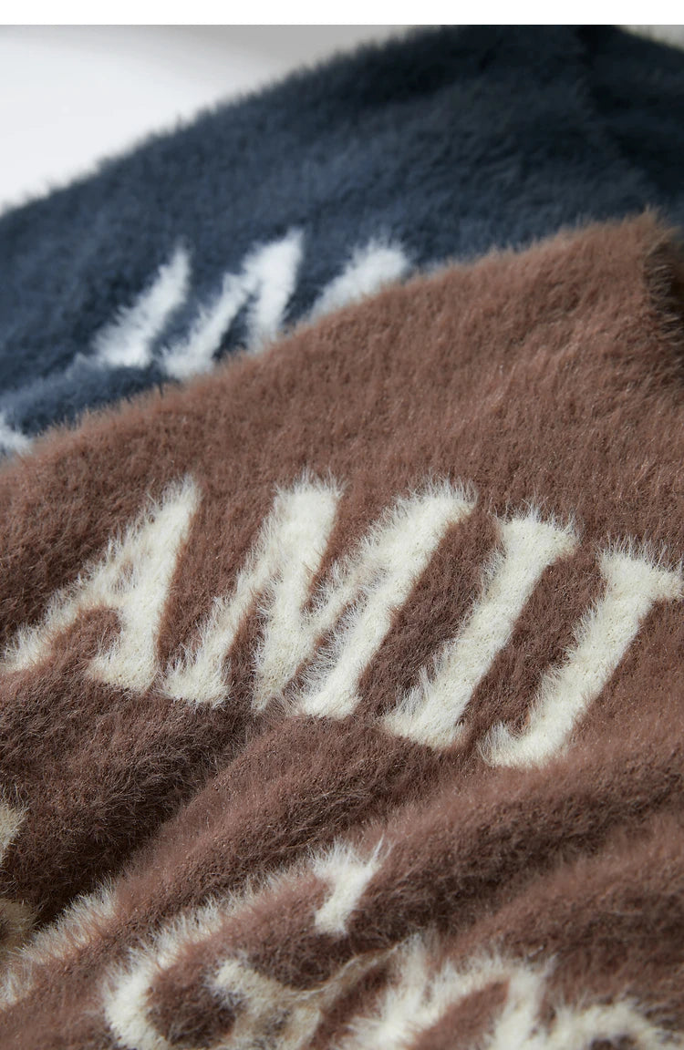 Damenpullover in Dunkelblau und Braun mit mehrfarbiger Jacquard-Schrift