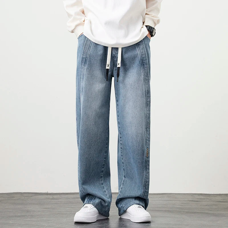 Herren Jeanshose mit brauner Stickerei im Hip Hop Stil