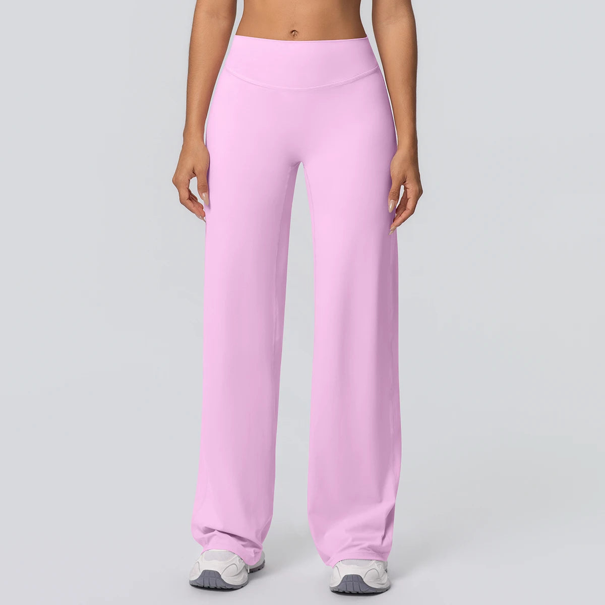 Weite Yoga-Hose in hellem Rosa, Vorderansicht mit hoher Taille und weitem, langem Bein.