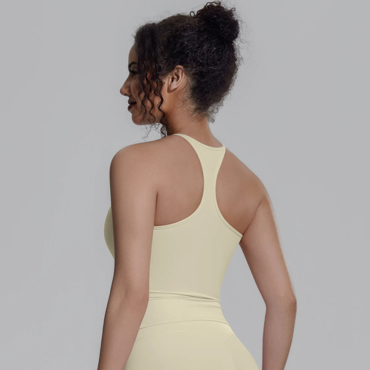 Damen-Sportweste mit Racerback, hellgelb/Creme, mit Brustpolster, Rückansicht