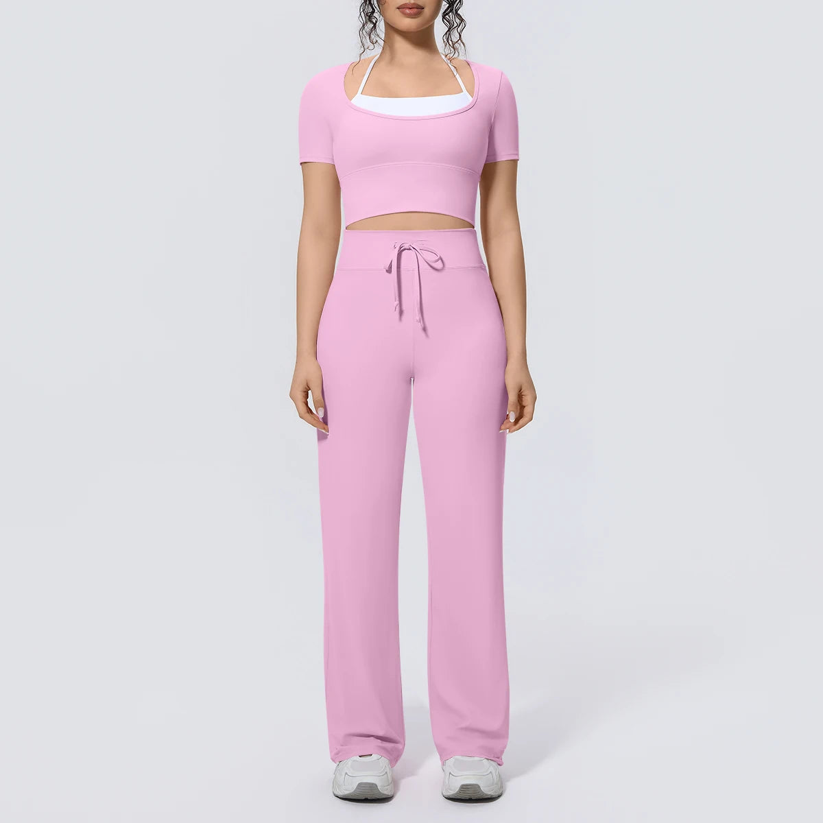 Rosa Yoga-Set mit kurzem Top und langer weiter Hose, Frontansicht