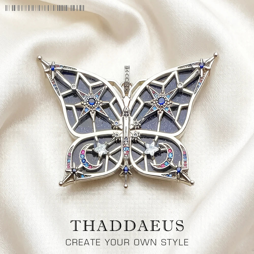 Schmetterlingsförmiger Anhänger aus 925 Sterlingsilber mit Stern- und Mondmotiven, blau