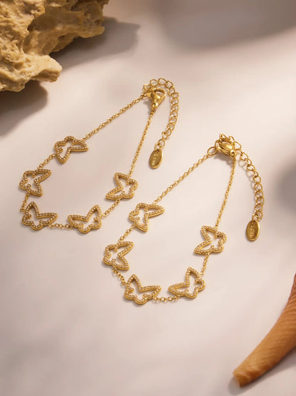 Damen-Charm-Armband mit Herzschleife und Zirkonia