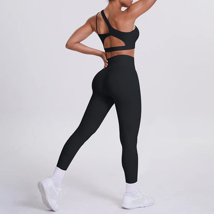 Yoga-Set aus Sport-BH und 3/4-Leggings, schwarz, mit Trägern und Aussparungen