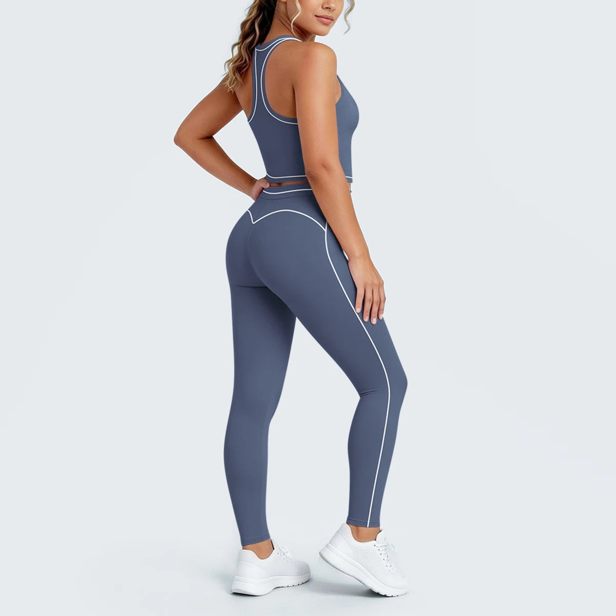 Seitliche Ansicht Yoga-Set: Sport-Top und Leggings, blau-grau, kontrastierte Steppnähte