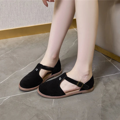 Damen-Ledersandalen in Schwarz mit flachem Absatz, Riemen mit Schnalle und offener Vorderseite