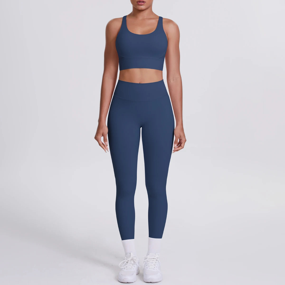 Yoga-Set: dunkelblaue High-Waist Fitnesshose mit passendem Sport-BH vorn