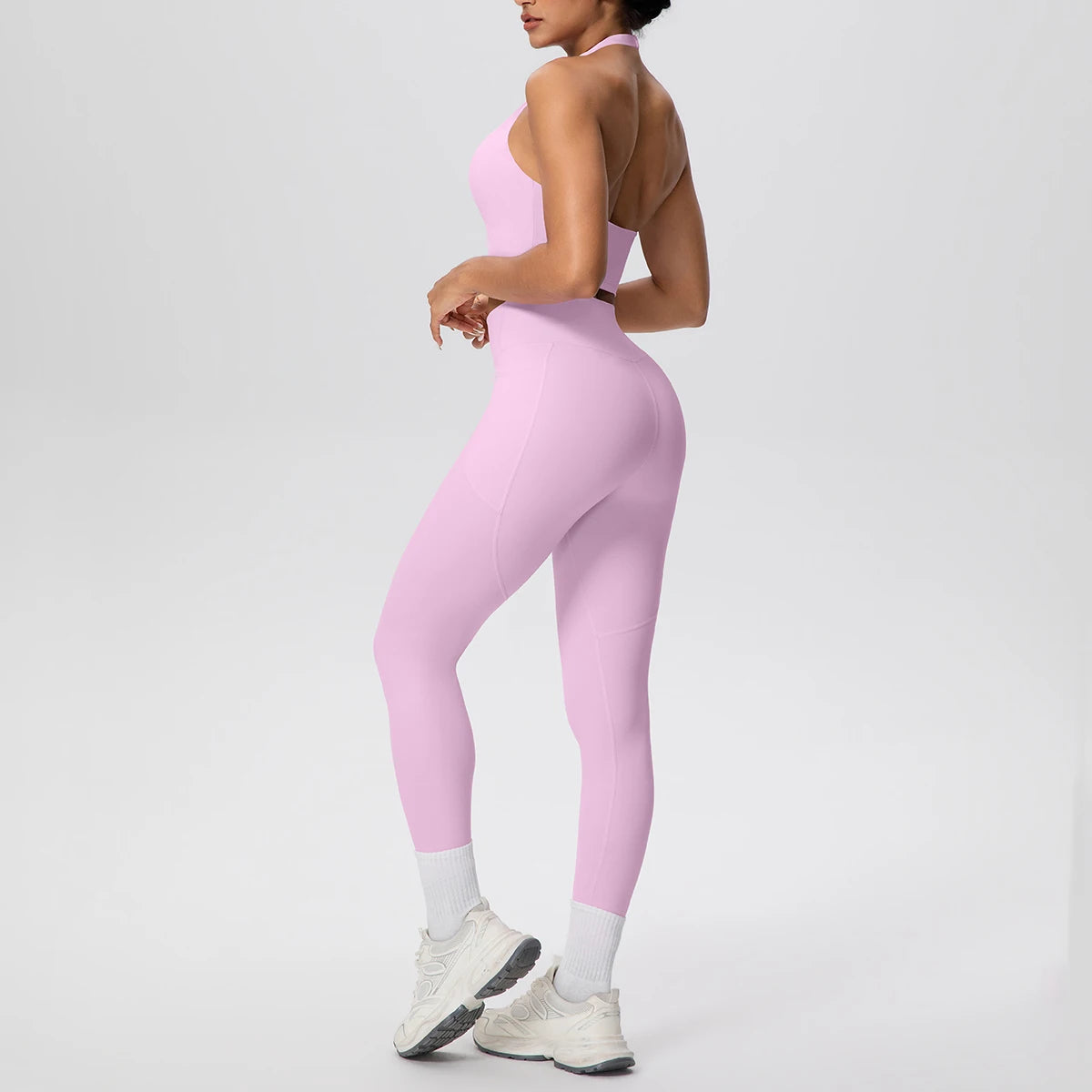 Lila Yogaset für Frauen: ärmelloser Sport-BH und lange Leggings, seitliche Ganzansicht