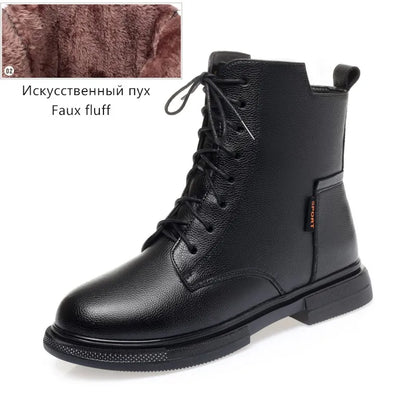 Schwarze Damen-Winterstiefeletten mit Schnürung, Kunstfellbesatz und gepolsterter Zunge.