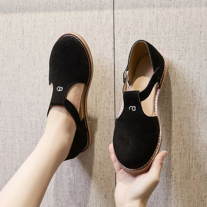 Damen-Ledersandalen in Schwarz mit flacher Sohle, breitem Riemen und runder Zehenöffnung