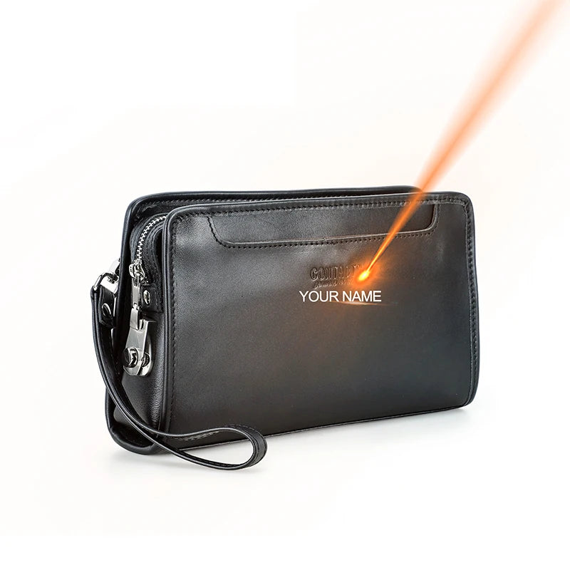 Dunkle Herren-Ledertasche mit Trageriemen, Reißverschluss und goldfarbenem Schubverschluss