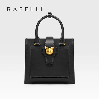 Schwarze Lederhandtasche mit Form, goldfarbener Katzenkopf-Applikation und kurzen Henkeln