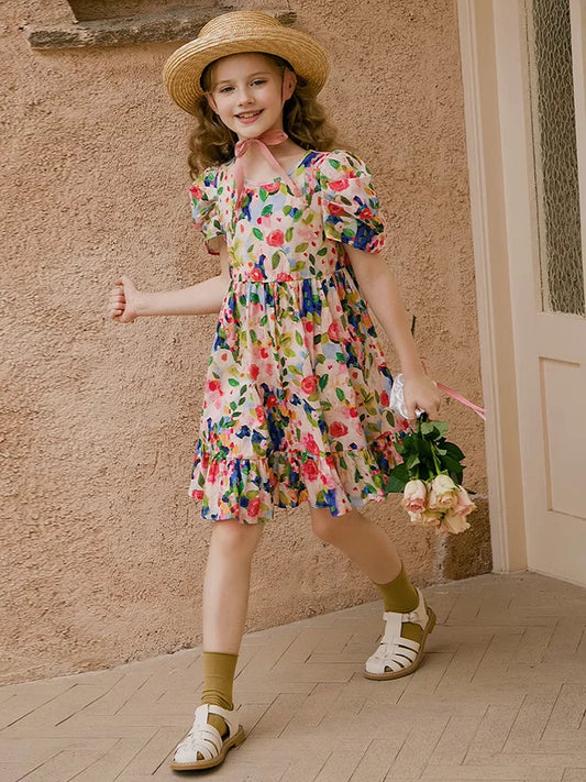 Ärmelloses Sommerkleid für Mädchen aus beiger, lockerer Gaze mit Stern- und Mondpailletten – ideal für Hochzeiten und Partys.
