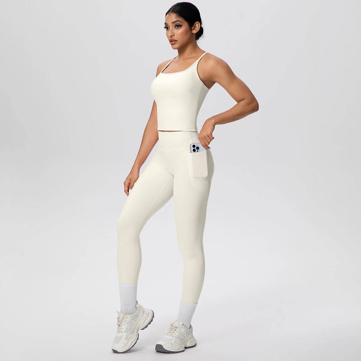 Damen Yoga-Set aus ärmellosem Top und Leggings, elfenbeinfarben, mit hellen Knieländern