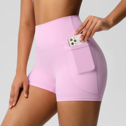 Damen-Yogashorts hohe Taille mit Seitentaschen, hellrosa, mit eingestecktem Handy