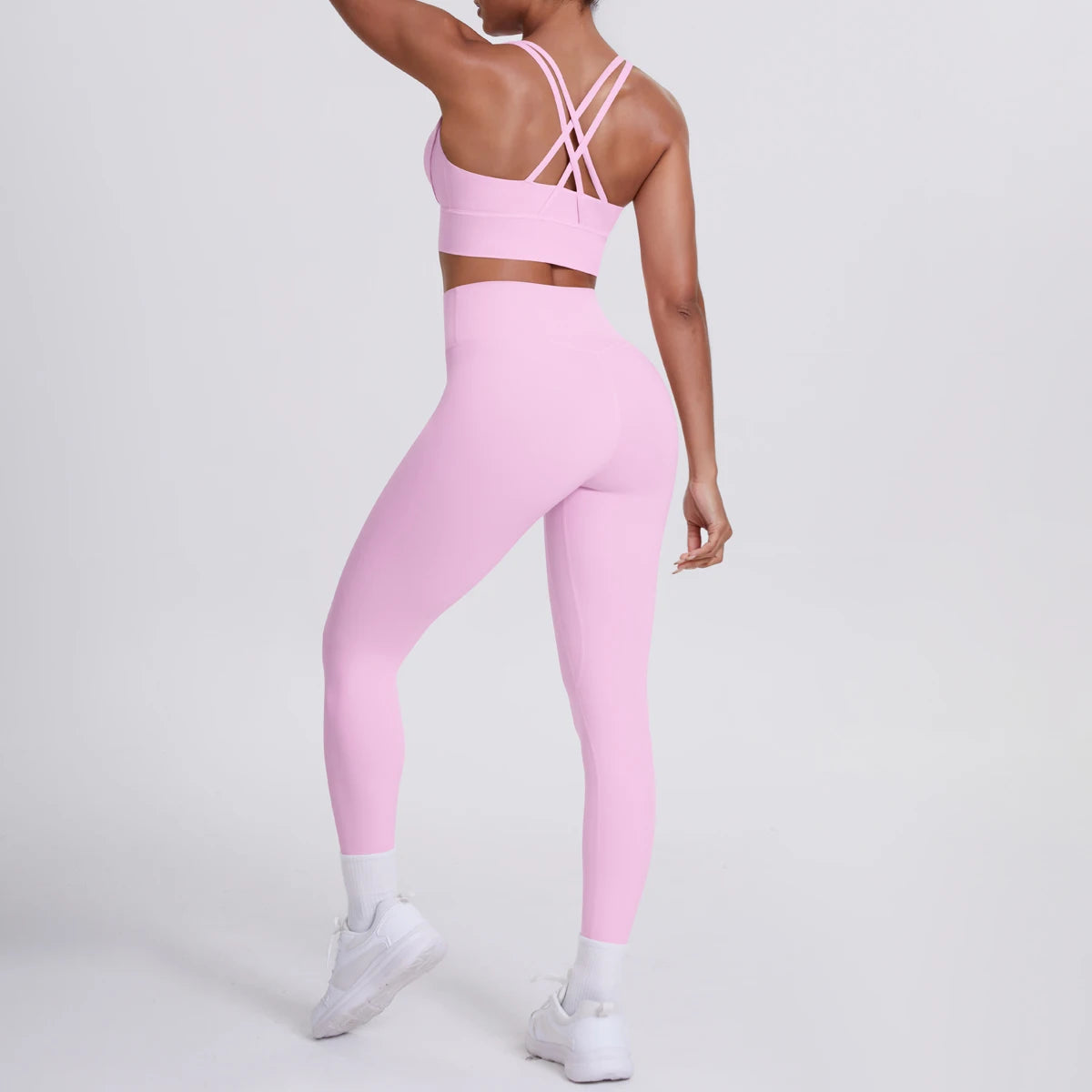 Fitness-Set Hellrosa: Sport-BH mit gekreuzten Rückenträgern, High-Waist-Leggings