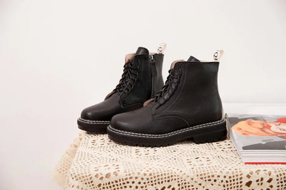 Schwarze Stiefeletten (Paar) mit Schnürung und seitlichem Einstieg, dicke Laufsohle