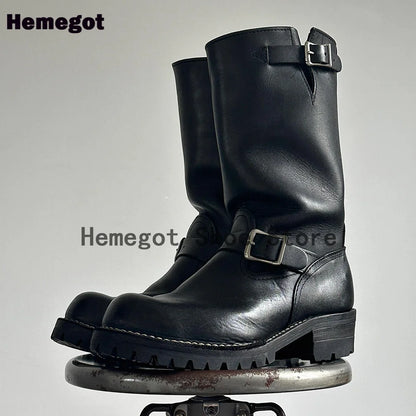 Schwarze Herren-Stiefeletten aus Leder mit Schnallenriemen und robuster Profilsohle