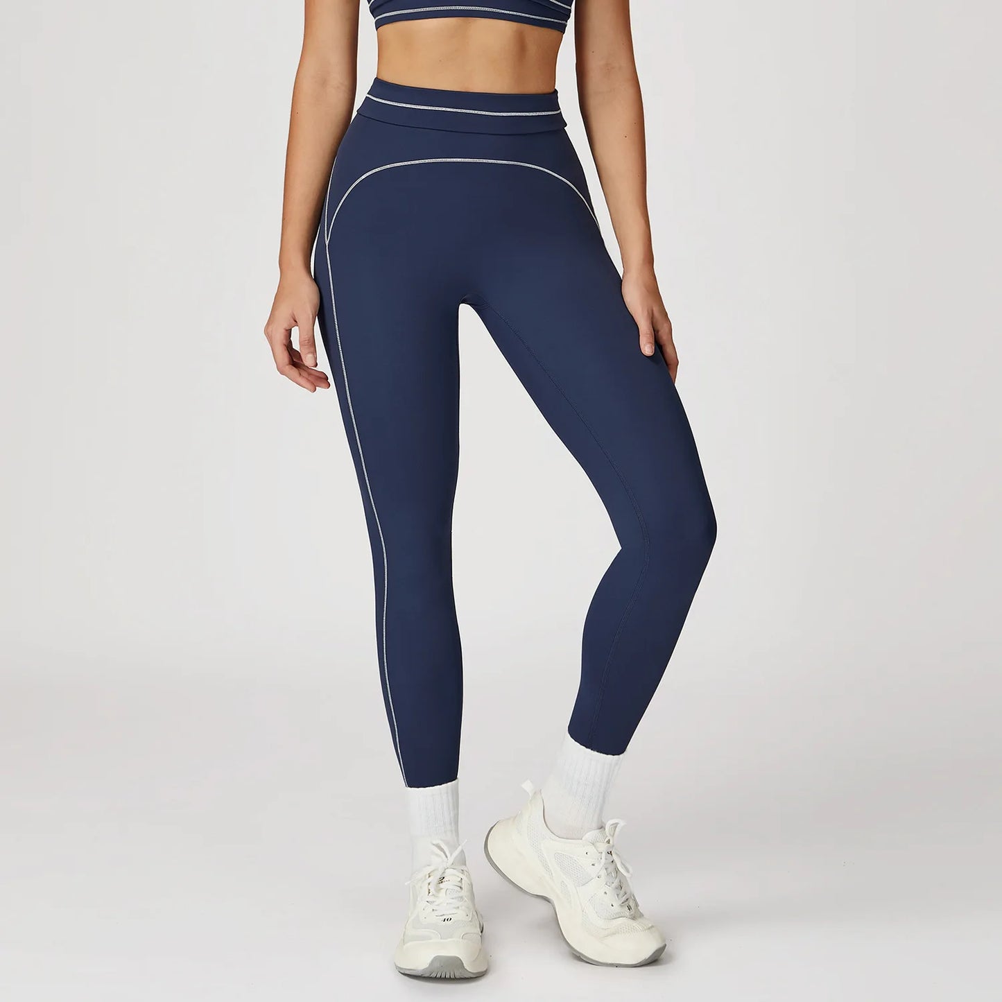 Dunkelblaue Yoga-Leggings mit Color-Block, schmalen Kontrastnähten und Konturstreifen