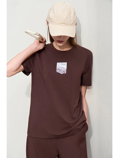 Damen T-Shirt aus Baumwolle mit lässigem O-Ausschnitt und modischer Stickerei