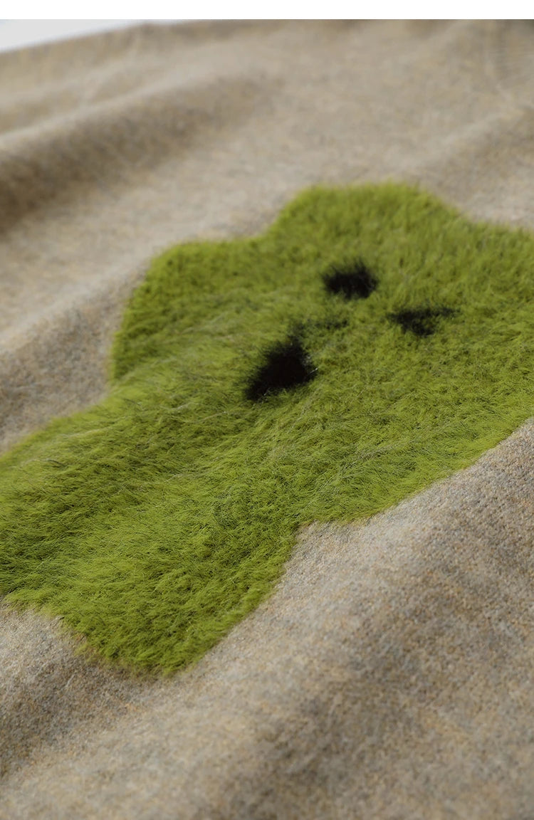 Beiger Damenpullover mit grünem Jacquard-Tiermotiv und lockerer Passform