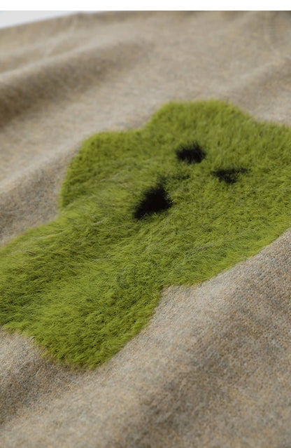 Beiger Damenpullover mit grünem Jacquard-Tiermotiv und lockerer Passform