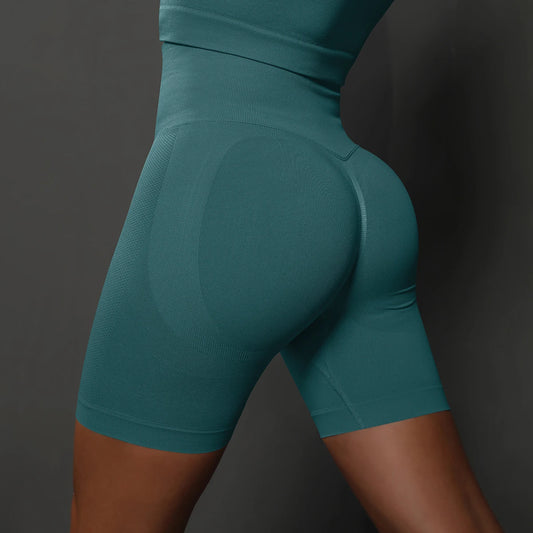 Nahtlose Damen-Sportshorts in Petrol, hinten mit konturierter Naht